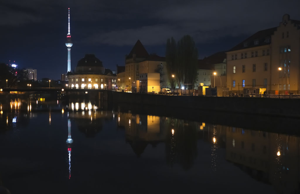 BERLIN, GERMANY -   A view of the Television Tower (Fernsehturm), one of the symbols of Berlin, as its reflection on the Spree River at night in Berlin, Germany  (Photo by Halil Sagirkaya/Anadolu via Getty Images)